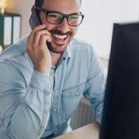 guy talking on phone in his office with Chiller Portable AC