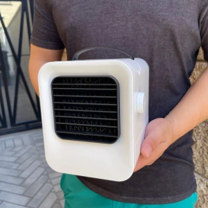 guy holding Chiller Portable AC