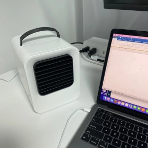 Chiller Portable AC next to laptop on office desk