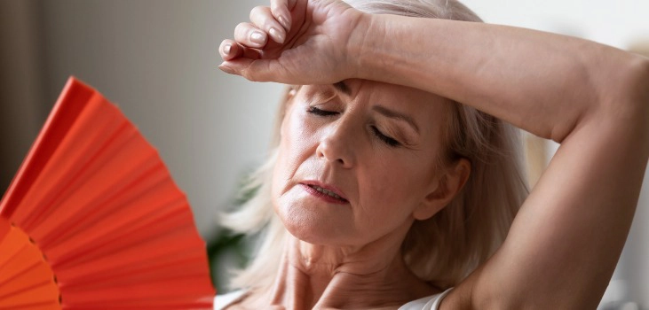 Close up of senior woman suffering from heatstroke at home