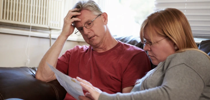 Chiller Portable AC Connecticut residents sitting on couch and being concerned about hefty electricity bills